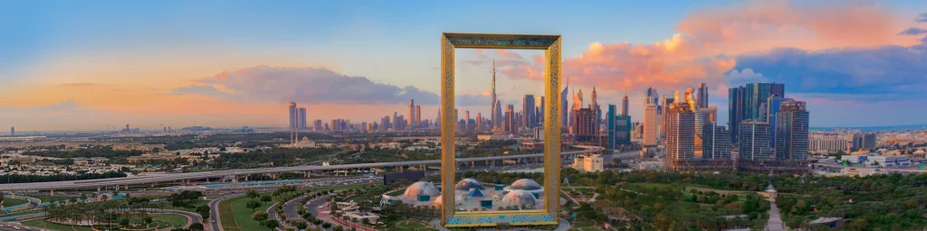 aerial view of dubai frame at sunset hp w1920x480
