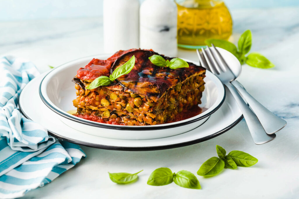 gluten free vegan lasagna. from grilled eggplant, green peas, lentils and vegetables. delicious healthy comfort food for the whole family for the holidays. italian parmigiana